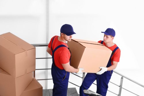 Professional removals team planning a move in Barnes residential street