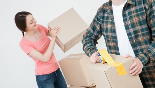 Professional movers handling office equipment during a Barnes relocation