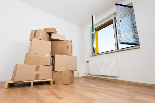 Packed boxes and furniture prepared for removal services in Barnes