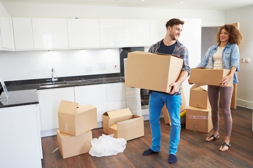 Removal team handling furniture during a local house move