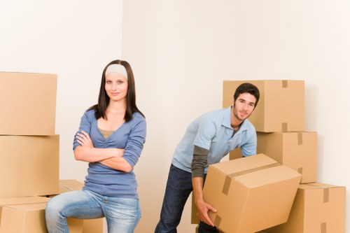 Packed office boxes and equipment ready for a Barnes removal