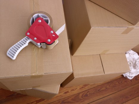 Careful boxing and labelling of household items in Barnes