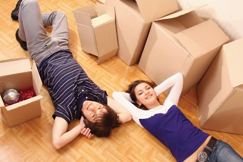 Furniture and packed boxes being unloaded at a Barnes property